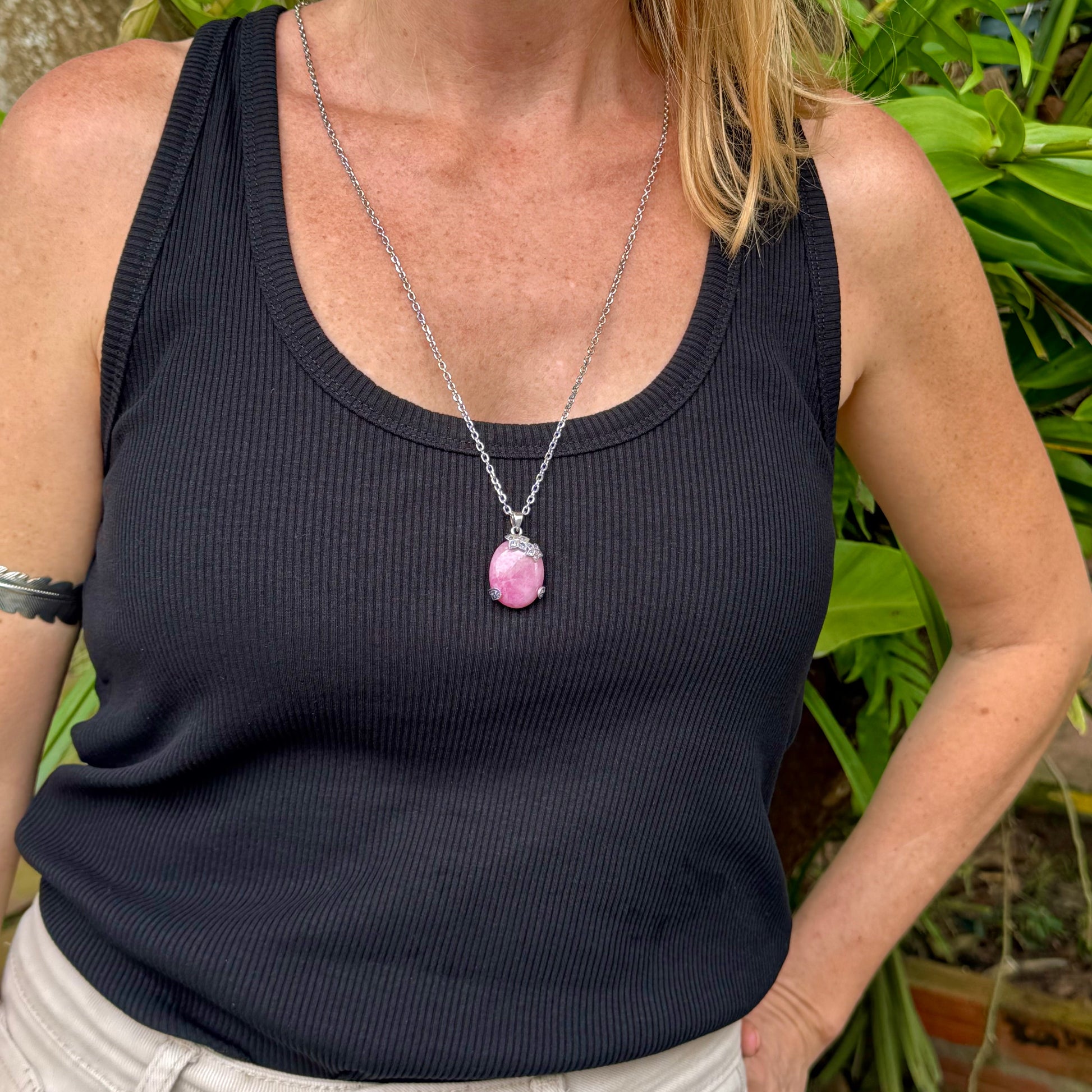 Handcrafted pendant with 46.3 ct natural ruby cabochon and 2.05 ct light blue sapphires in a white-gold-plated silver floral design.