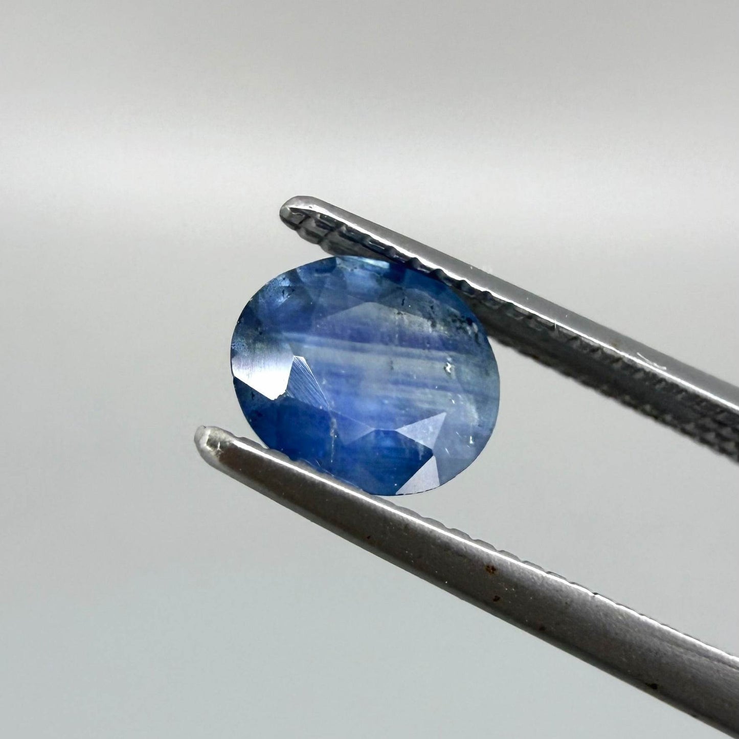 0.85 ct natural blue sapphire from Bangkaja, oval cut.