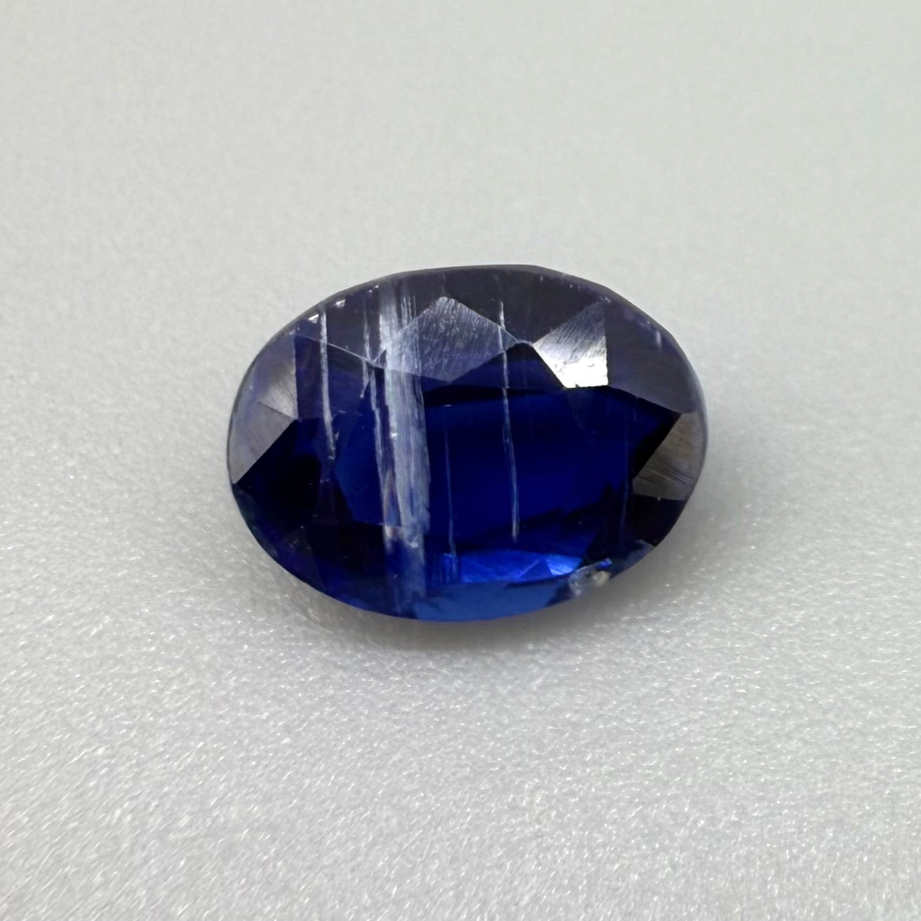 Natural Royal Blue, white stripe inclusions Kyanite gemstone, oval cut