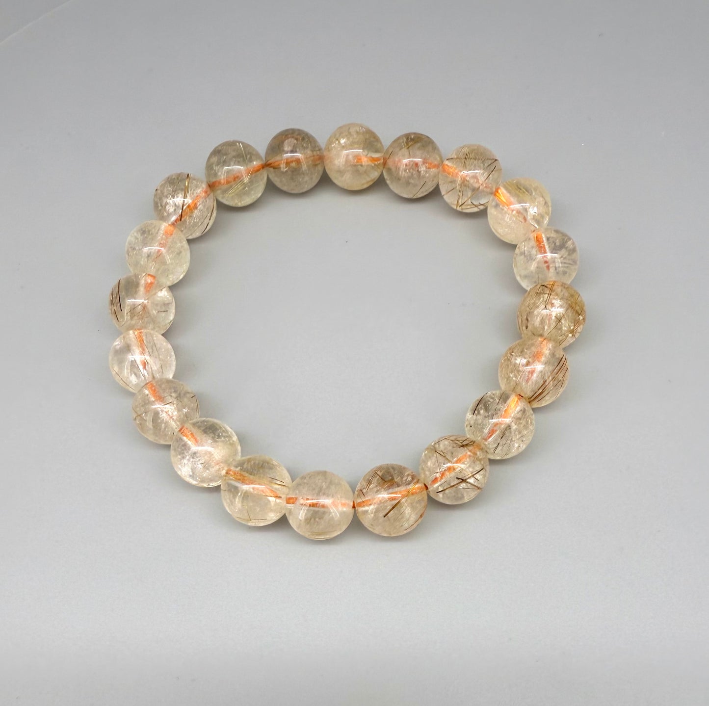 Bronze rutilated quartz beaded bracelet, natural gemstone beads with bronze rutile threads on elastic stretch band.