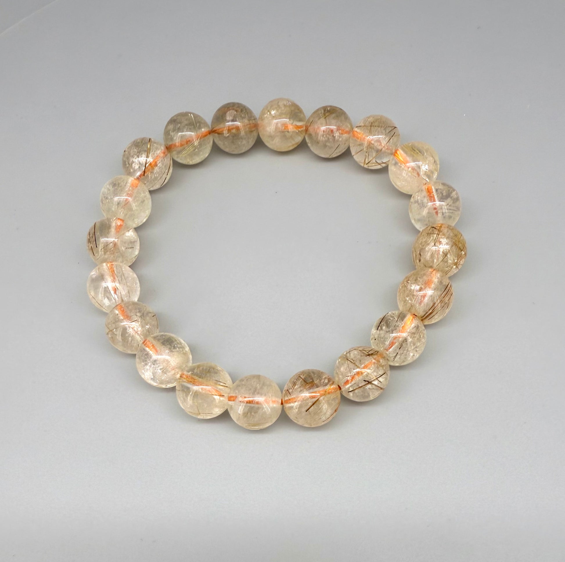 Bronze rutilated quartz beaded bracelet, natural gemstone beads with bronze rutile threads on elastic stretch band.