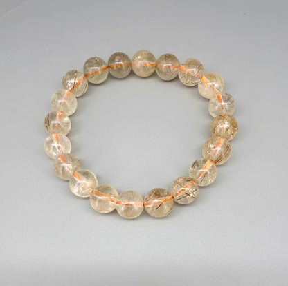 Bronze rutilated quartz beaded bracelet, natural gemstone beads with bronze rutile threads on elastic stretch band.