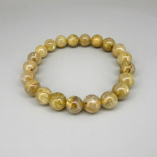 Rutilated quartz beaded bracelet, natural gemstone beads with golden rutile threads on elastic stretch band