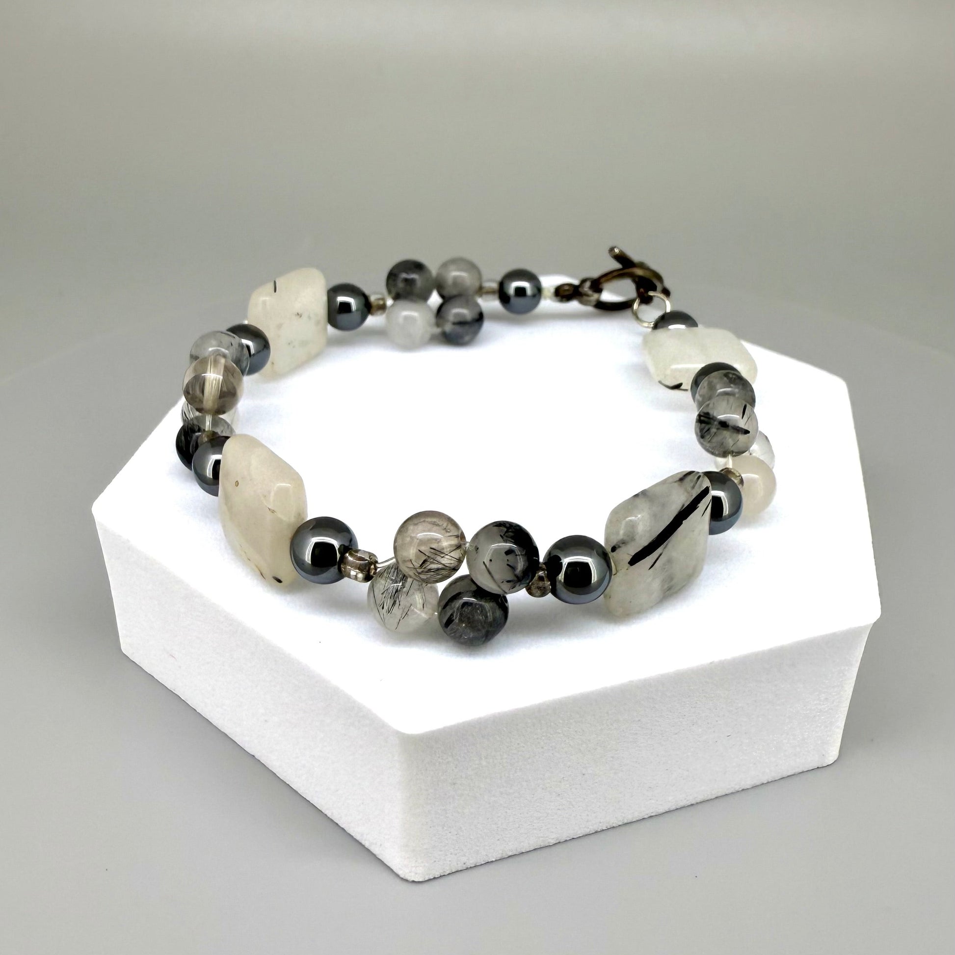 Rutilated quartz and hematite beaded bracelet, natural gemstone beads with toggle clasp.
