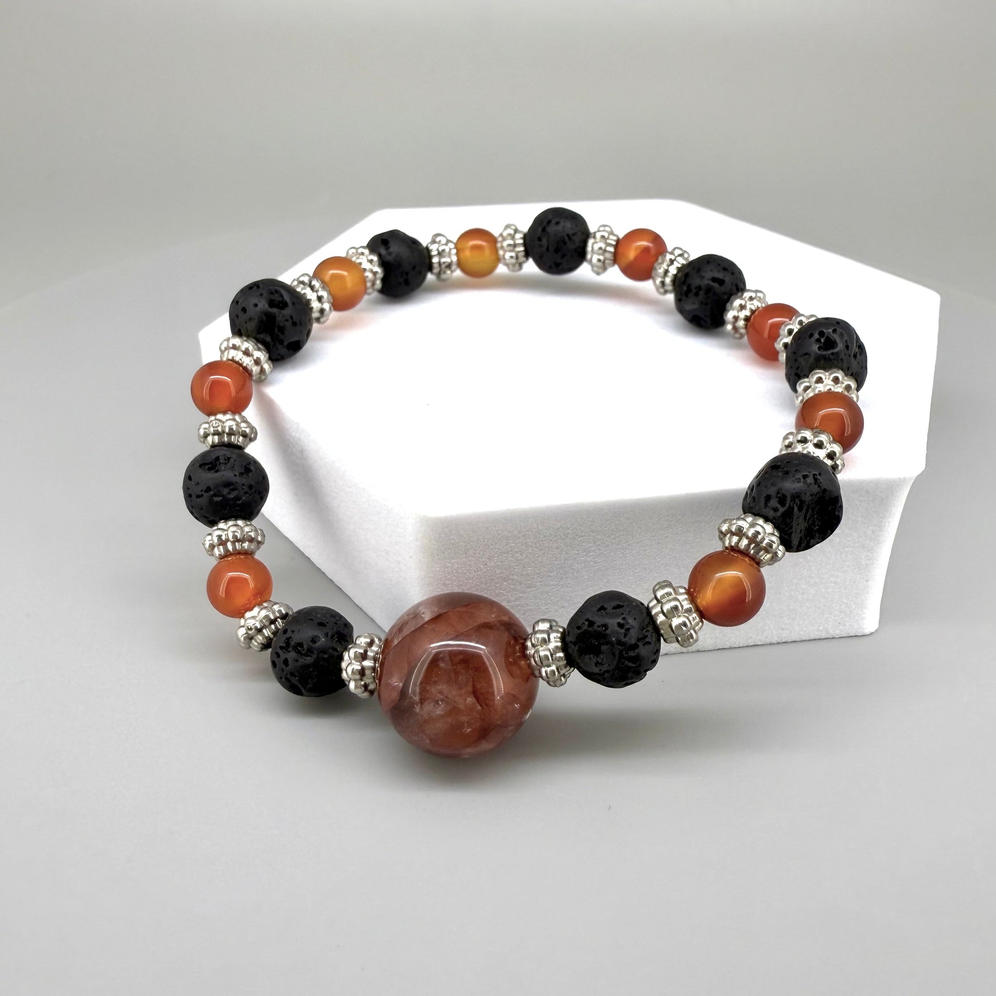 Alt-Text

Carnelian, lava, and cherry quartz beaded bracelet, 18cm, natural orange-red, matte black, and pink beads on elastic stretch band.