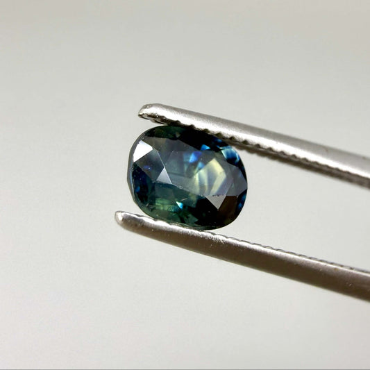 0.71 ct natural bi-color blue and yellow sapphire from Bangkaja, cushion cut.