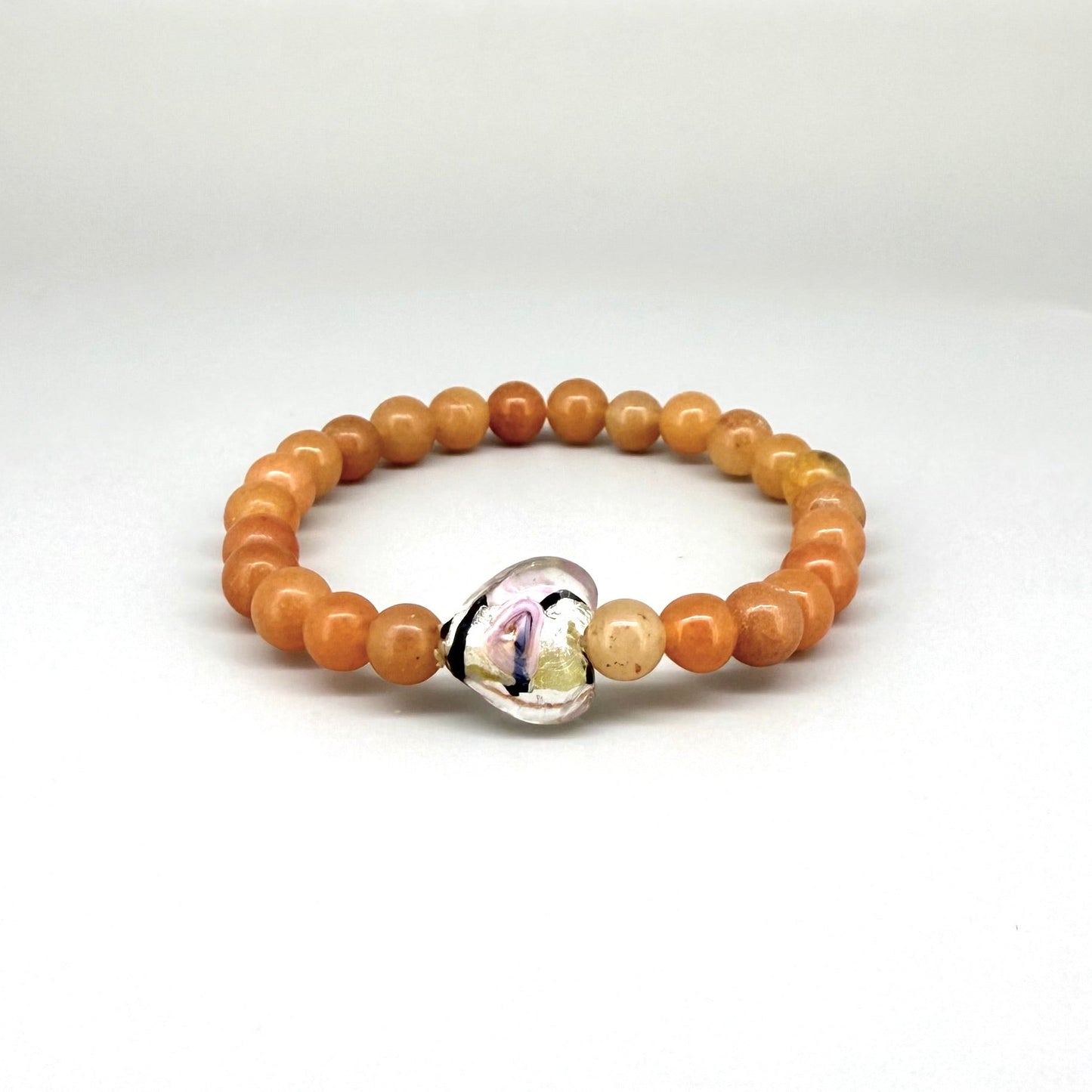 Agate beaded bracelet, 16cm, orange gemstone beads with glass heart focal bead on elastic stretch band.