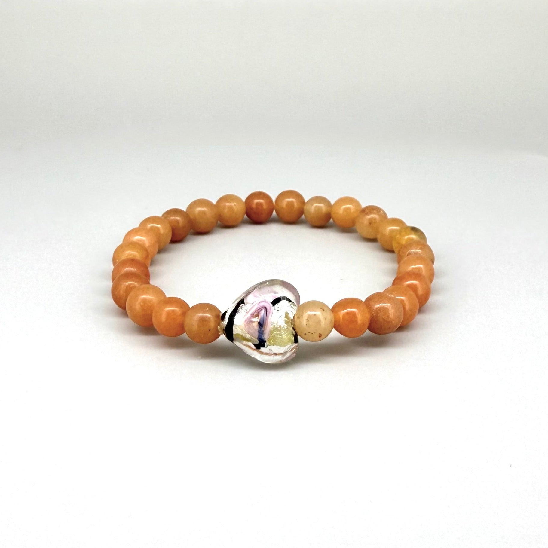 Agate beaded bracelet, 16cm, orange gemstone beads with glass heart focal bead on elastic stretch band.