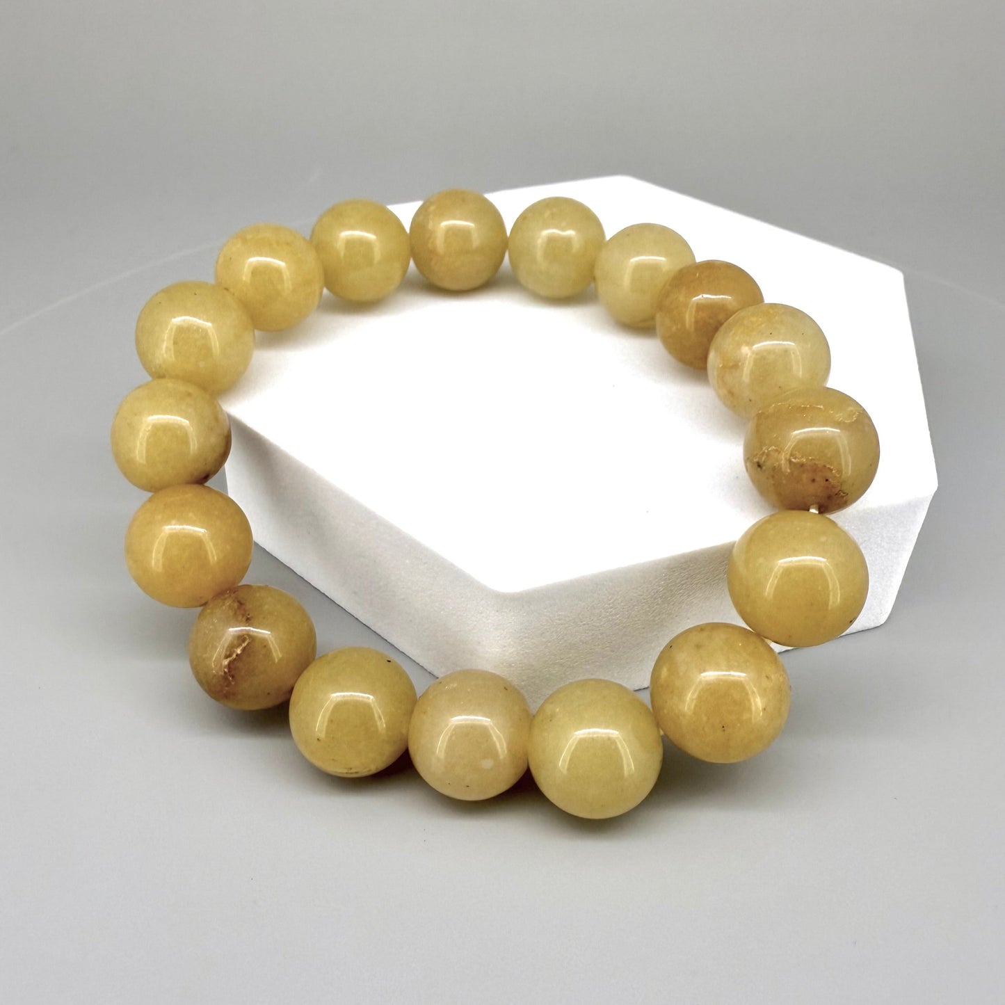 Jade beaded bracelet, 19cm, natural yellow-cream gemstone beads on elastic stretch band.