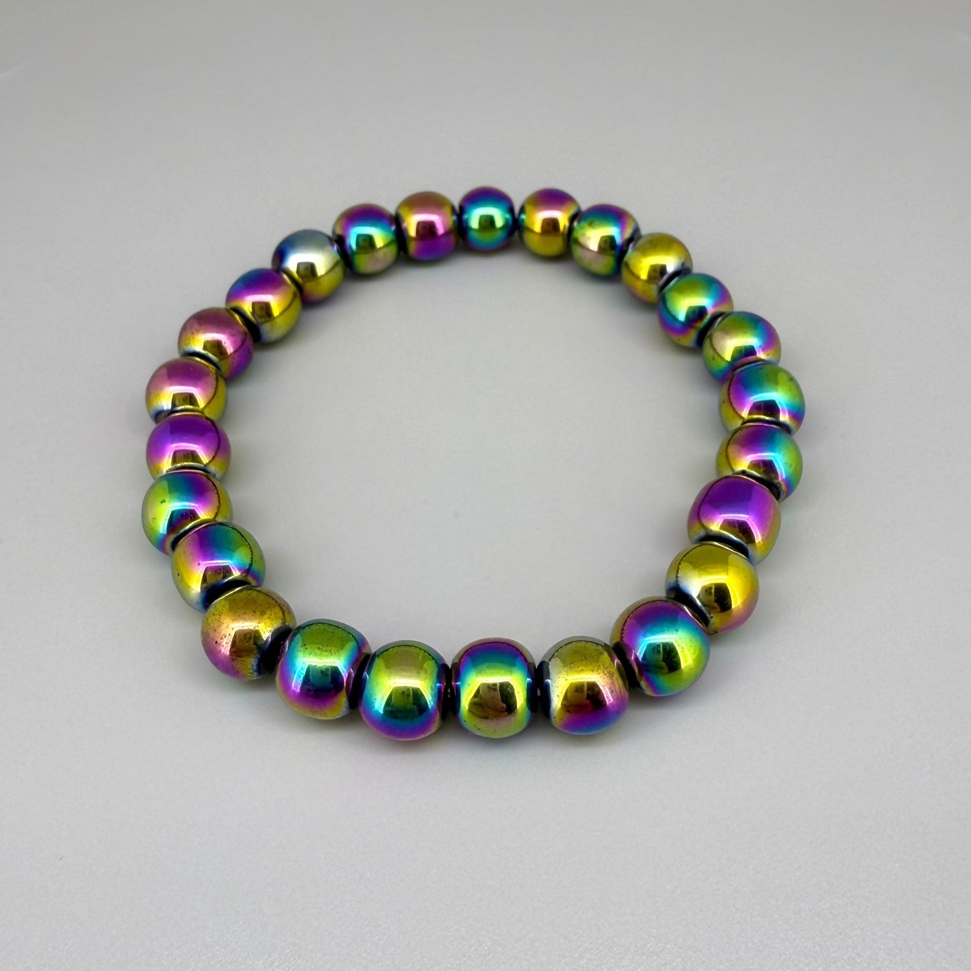 Rainbow hematite beaded bracelet, 18cm, iridescent multicolor gemstone beads on elastic stretch band.