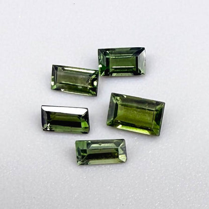 1.06 ct natural green sapphire lot from Thailand, baguette cut stones.