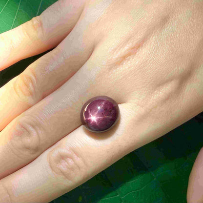 20.1 ct natural Pink-Red Star Ruby cabochon from Mozambique with soft star effect and polished dome.