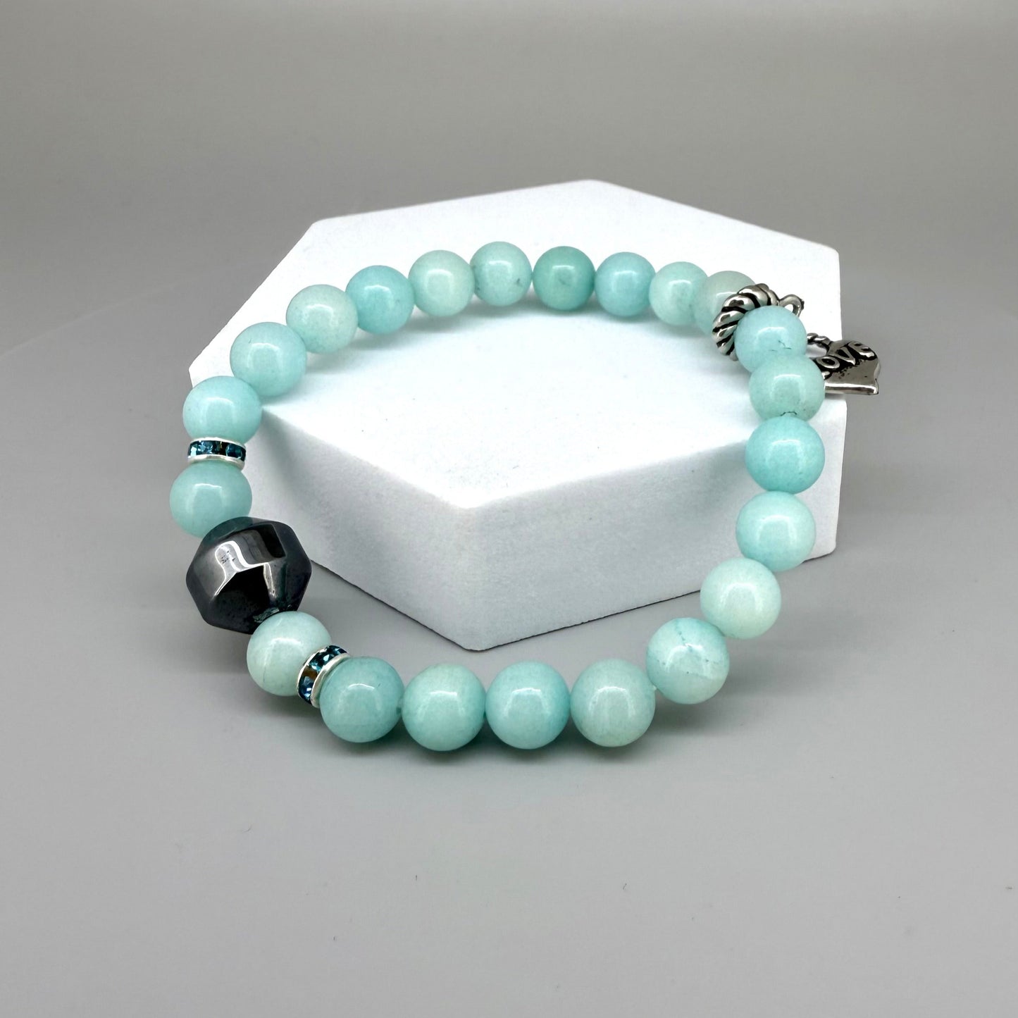 Agate beaded bracelet, 19cm, aqua-blue gemstone beads with decorative medallion accent on elastic stretch band.