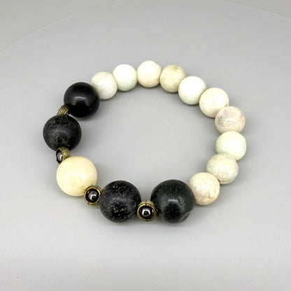 White jade, onyx, and hematite beaded bracelet, 18cm, natural white, black, and metallic grey gemstone beads with smaller hematite accents on elastic stretch band.