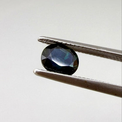 0.67 ct natural blue-green sapphire from Bangkaja, faceted cut.
