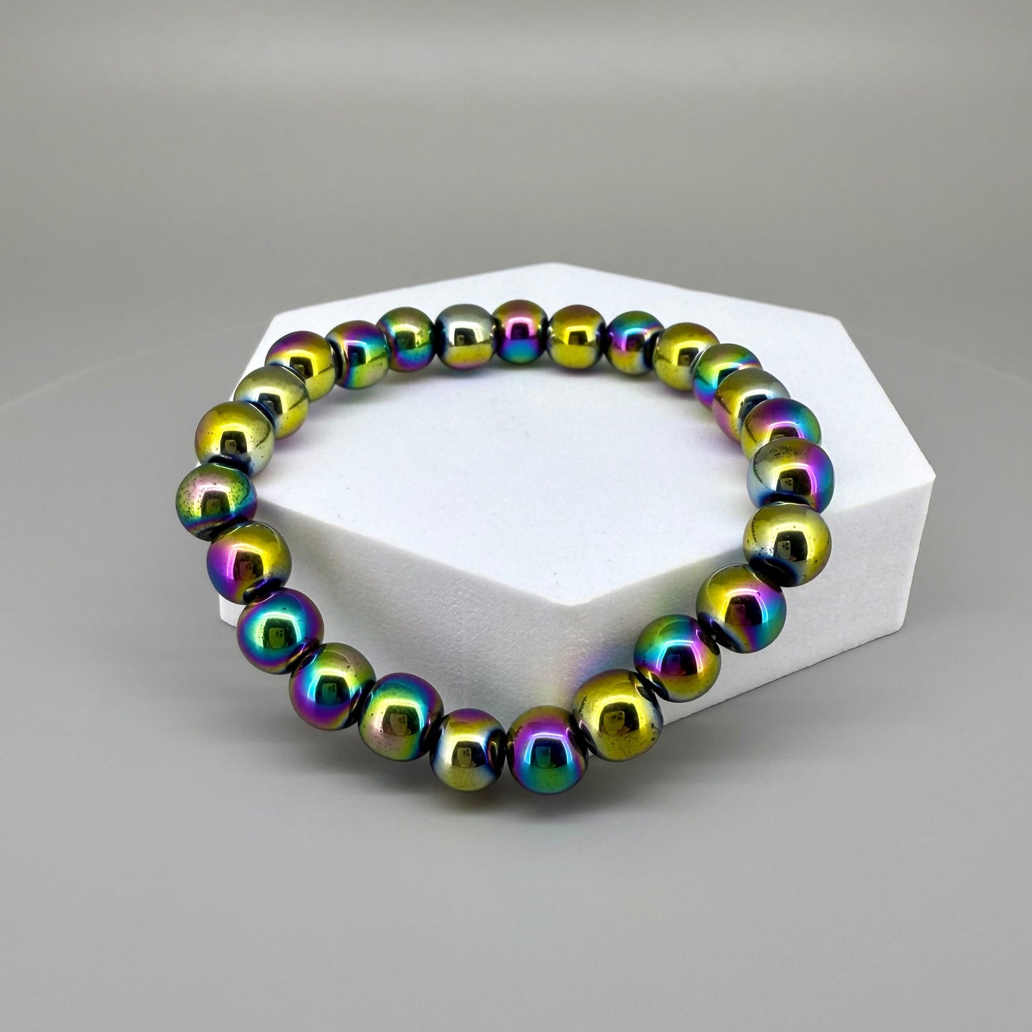 Rainbow hematite beaded bracelet, 18cm, iridescent multicolor gemstone beads on elastic stretch band.