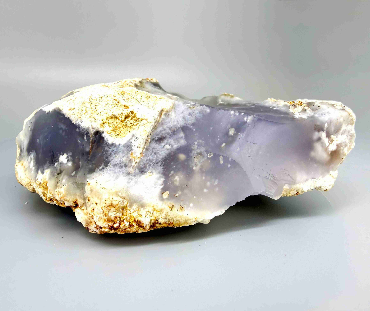 Untreated grey-blue chalcedony rough (quartz) stone with cloudy milky texture