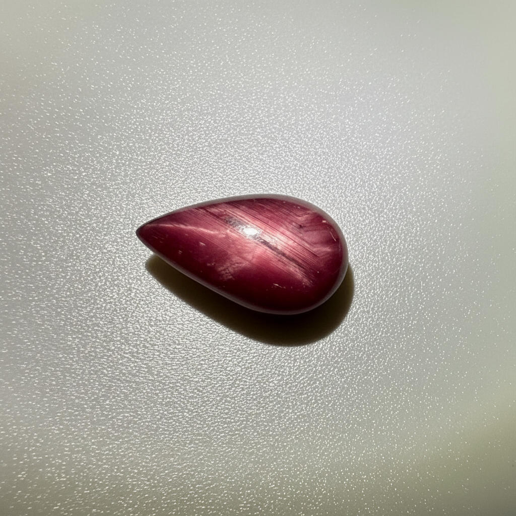 13.8 ct natural pear-shaped Star Ruby medallion cut, polished on both sides with a soft star effect and glossy surface, Mozambique.