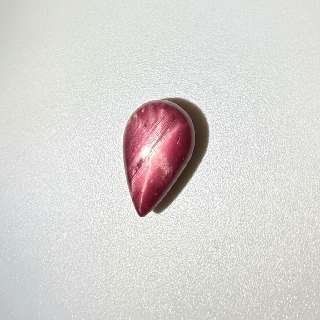 13.8 ct natural pear-shaped Star Ruby medallion cut, polished on both sides with a soft star effect and glossy surface, Mozambique.