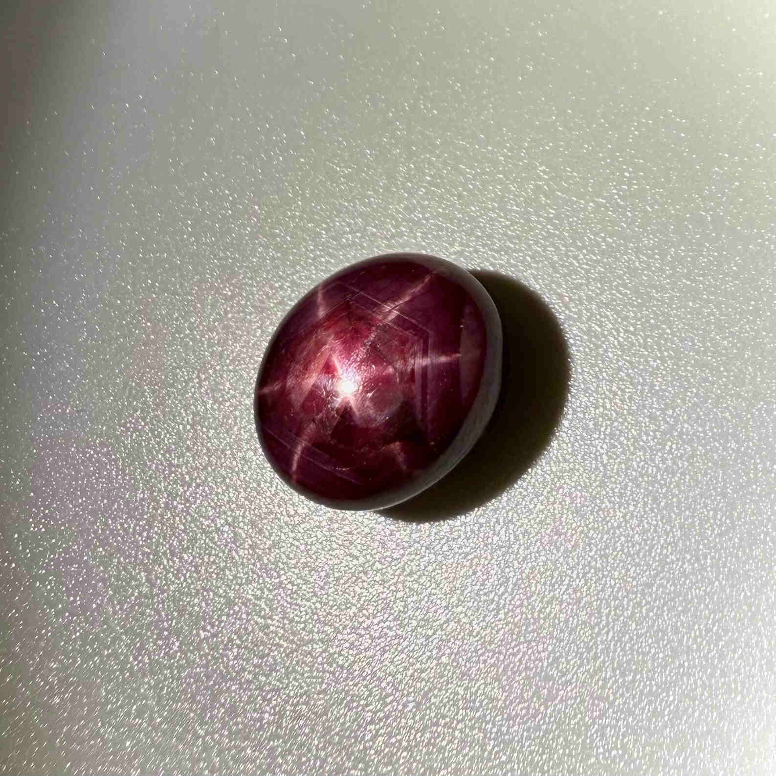 17.3 ct natural Pink-Red Star Ruby cabochon from Mozambique with soft star effect and polished dome.