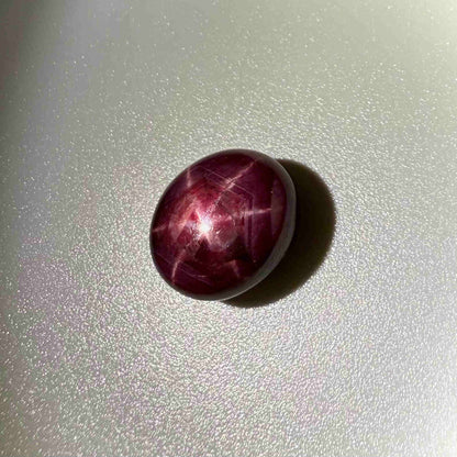 17.3 ct natural Pink-Red Star Ruby cabochon from Mozambique with soft star effect and polished dome.