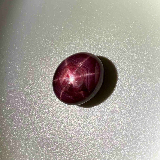 17.3 ct natural Pink-Red Star Ruby cabochon from Mozambique with soft star effect and polished dome.