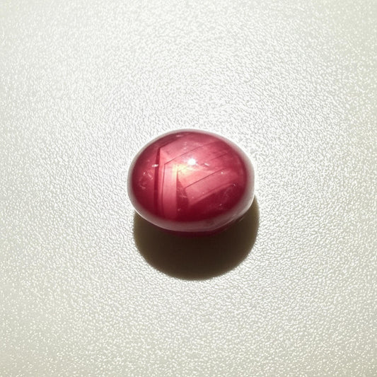 14.4 ct natural Pink-Red Star Ruby cabochon from Mozambique with soft star effect and polished dome.