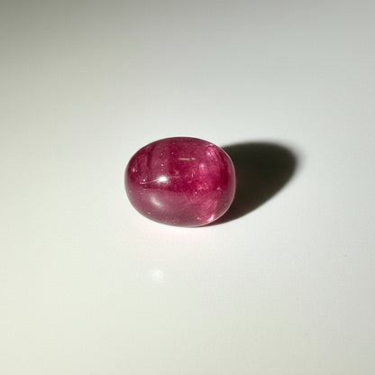 14.4 ct natural Pink-Red Star Ruby cabochon from Mozambique with soft star effect and polished dome.