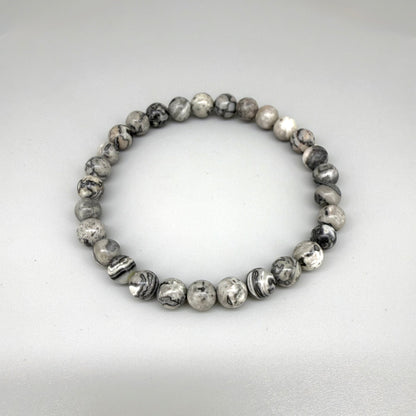 Jasper beaded bracelet, natural grey, black, and white marbled gemstone beads on elastic stretch band.