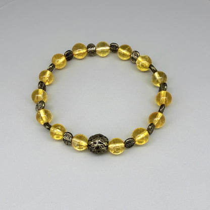 Citrine beaded bracelet, 18cm, golden-yellow gemstone beads with metal spacers on elastic stretch band.