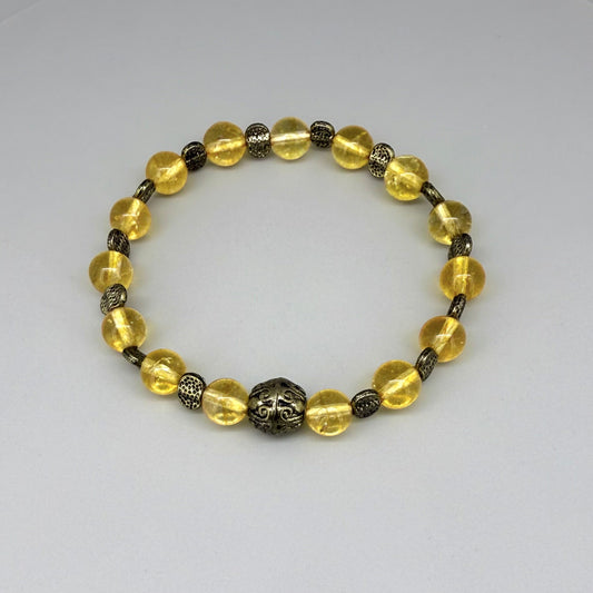 Citrine beaded bracelet, 18cm, golden-yellow gemstone beads with metal spacers on elastic stretch band.