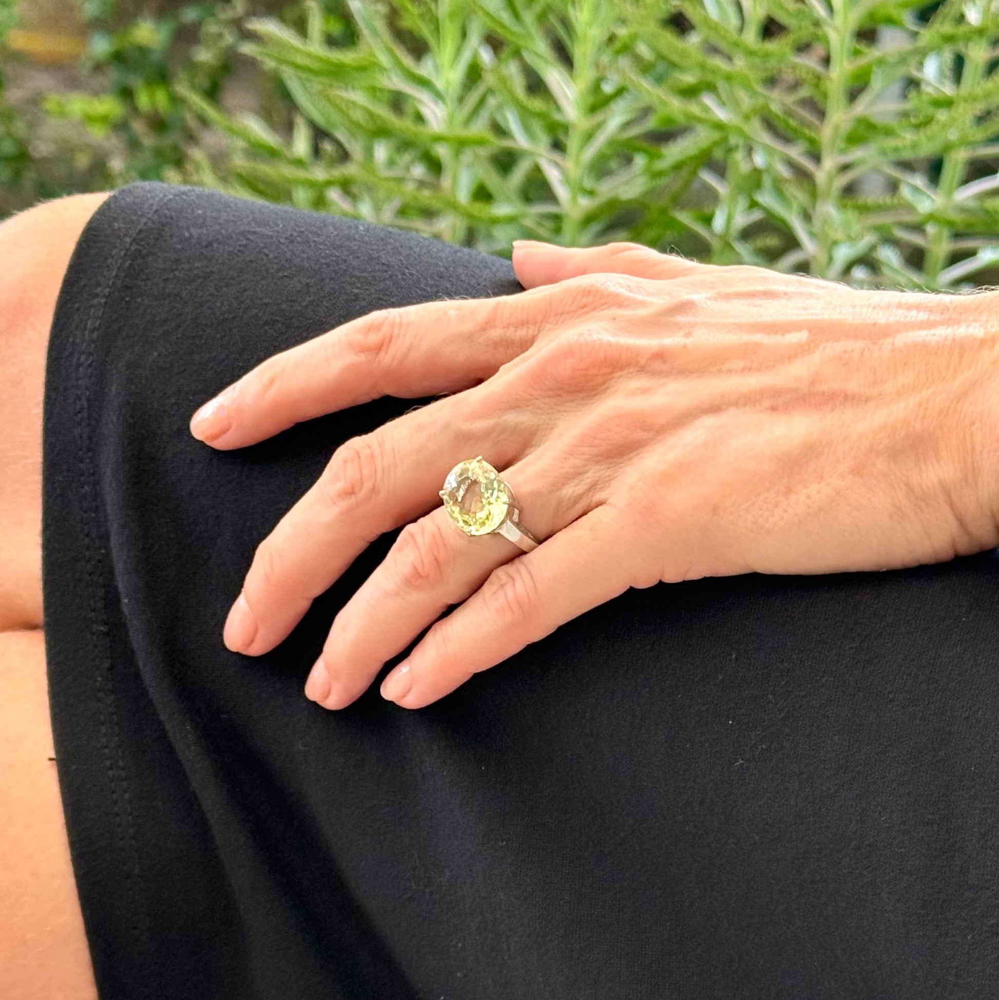 Lemon quartz solitaire ring in white gold plated sterling silver, featuring a large faceted yellow-green gemstone, bold and elegant design.