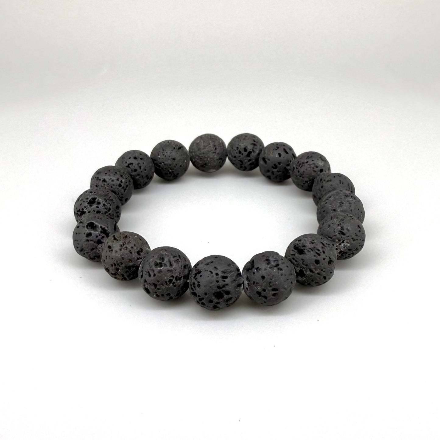 Lava beaded bracelet, 16cm, natural matte black porous gemstone beads on elastic stretch band.