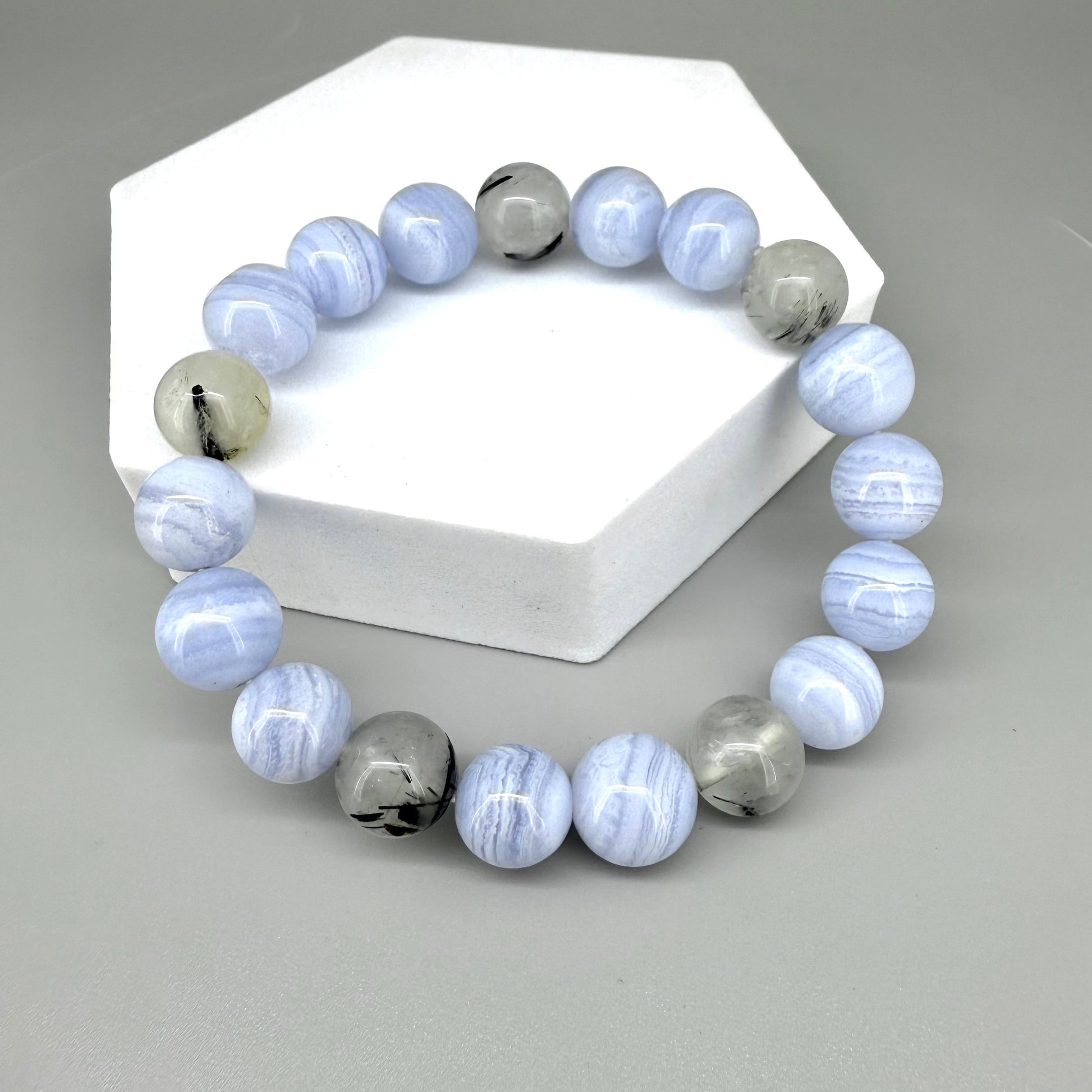 Chalcedony and rutilated quartz beaded bracelet, 18cm, light blue and grey gemstone beads with rutile inclusions on elastic stretch band.