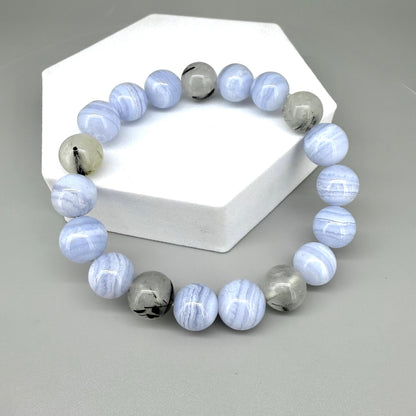 Chalcedony and rutilated quartz beaded bracelet, 18cm, light blue and grey gemstone beads with rutile inclusions on elastic stretch band.