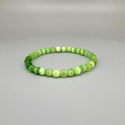 Cat’s Eye beaded bracelet, 18cm, natural shimmering grey gemstone beads on elastic stretch band.