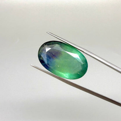 33.9 ct natural green-blue Fluorite, oval faceted, eye-clear with slight dusty or milky appearance, from Africa.
