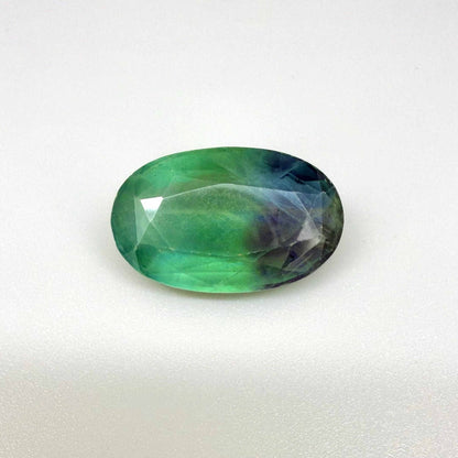 33.9 ct natural green-blue Fluorite, oval faceted, eye-clear with slight dusty or milky appearance, from Africa.