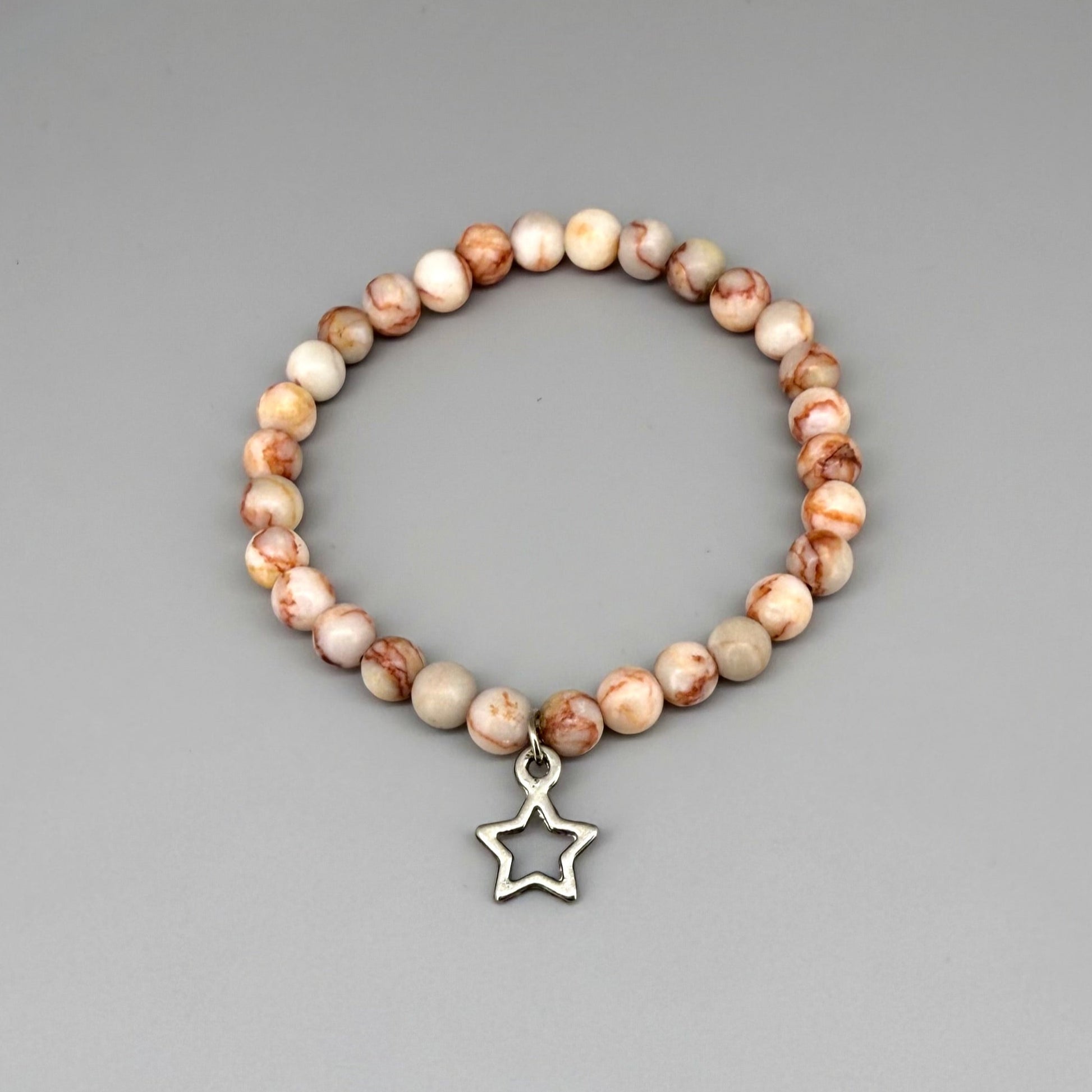 Orange-beige jasper beaded bracelet, 17cm, natural gemstone beads with star charm on elastic stretch band.