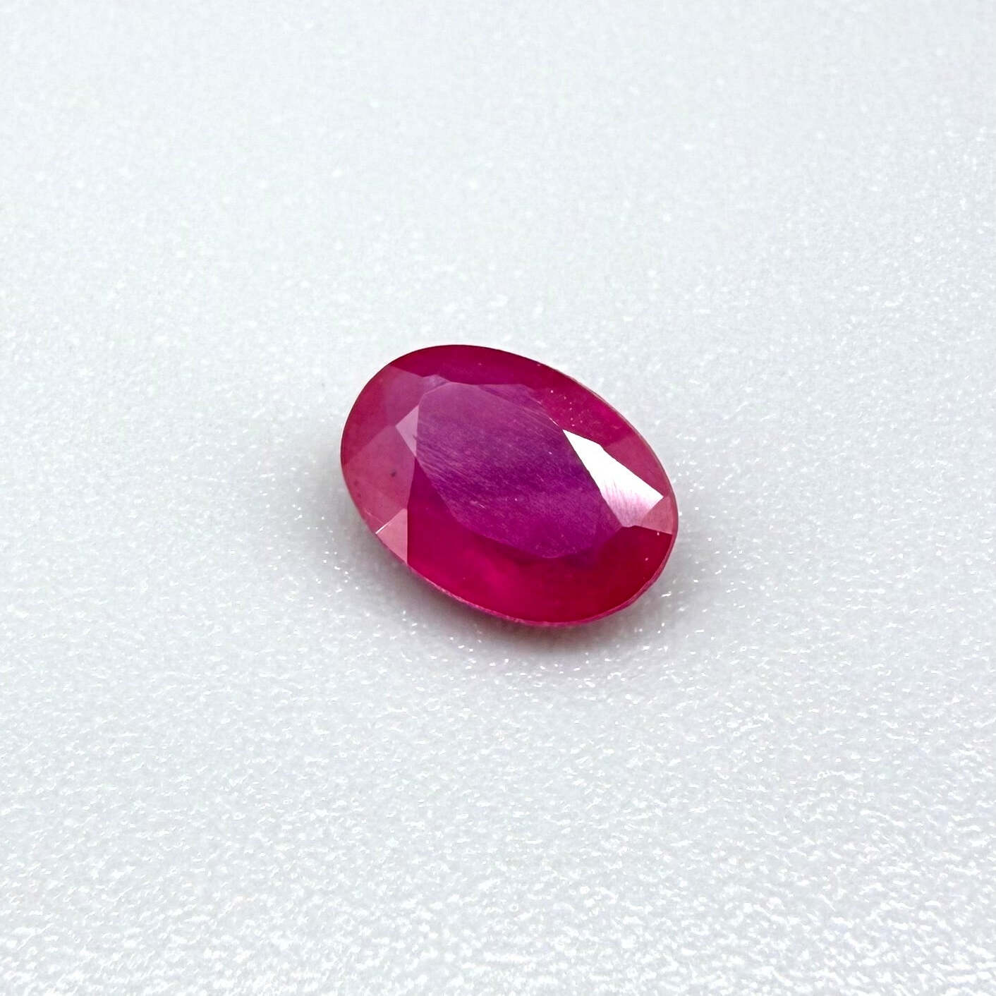 0.87 ct natural pink-red Songea ruby, oval cut.