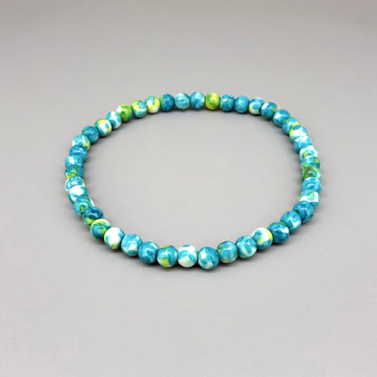 Jade beaded bracelet, 18cm, gemstone beads in turquoise, yellow, and white tones on elastic stretch band.