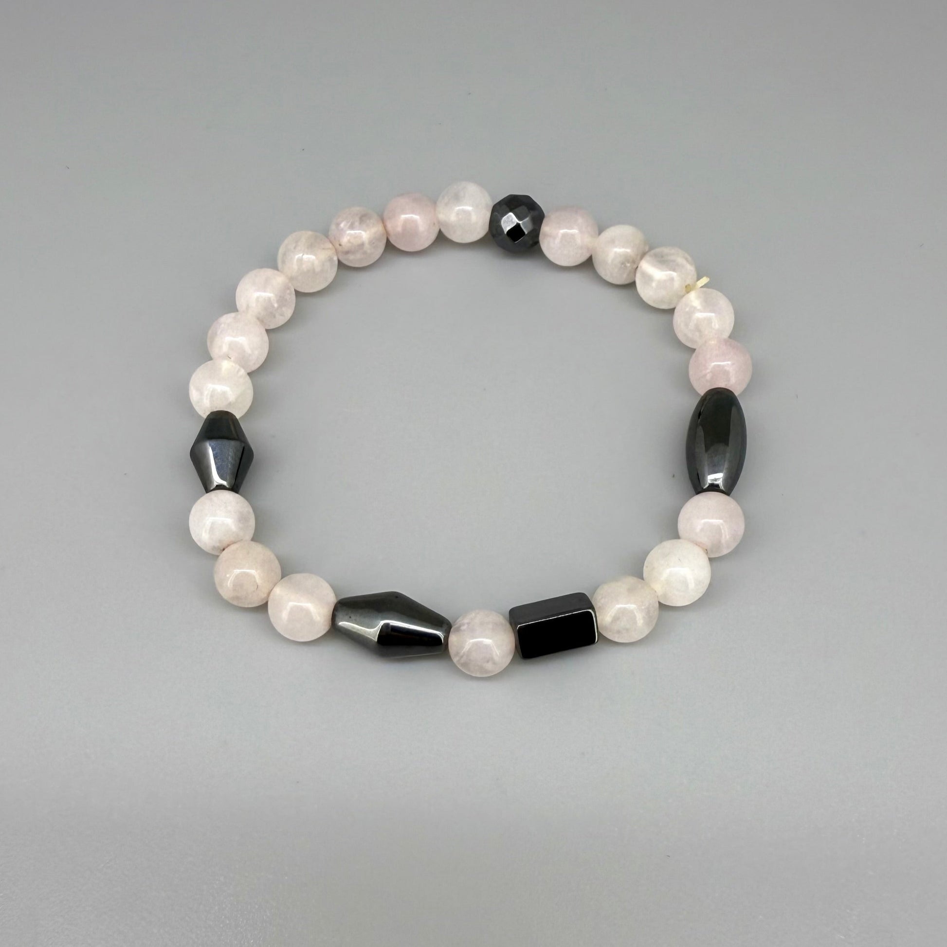 Rose quartz and hematite beaded bracelet, 18cm, soft pink gemstone beads with metallic hematite spacers on elastic stretch band.
