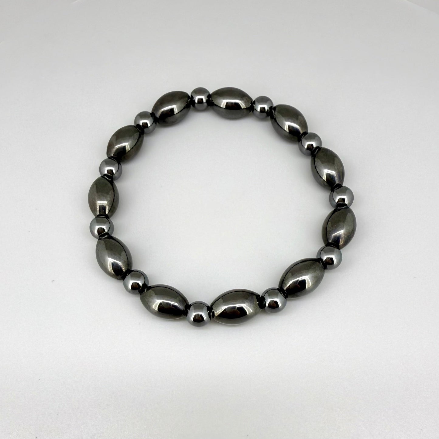 Hematite beaded bracelet, 19cm, dark metallic grey magnetic gemstone beads on elastic stretch band.