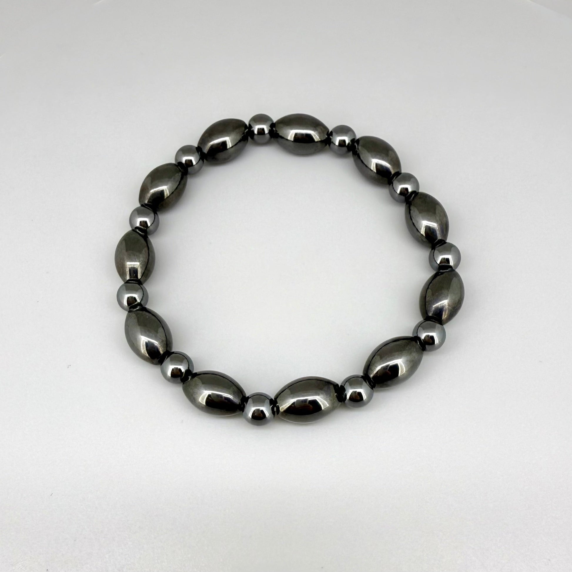 Hematite beaded bracelet, 19cm, dark metallic grey magnetic gemstone beads on elastic stretch band.