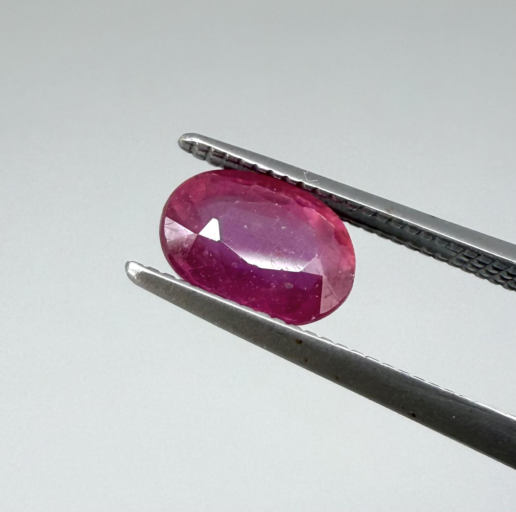 1.7 ct natural pink-red Songea ruby, oval cut.