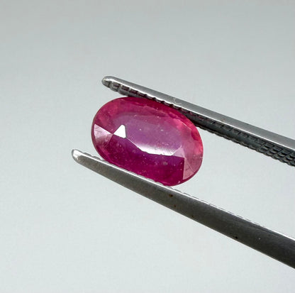 1.7 ct natural pink-red Songea ruby, oval cut.
