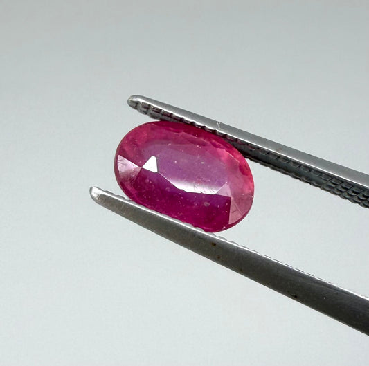 1.7 ct natural pink-red Songea ruby, oval cut.