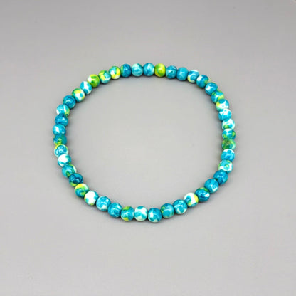 Jade beaded bracelet, 18cm, gemstone beads in turquoise, yellow, and white tones on elastic stretch band.