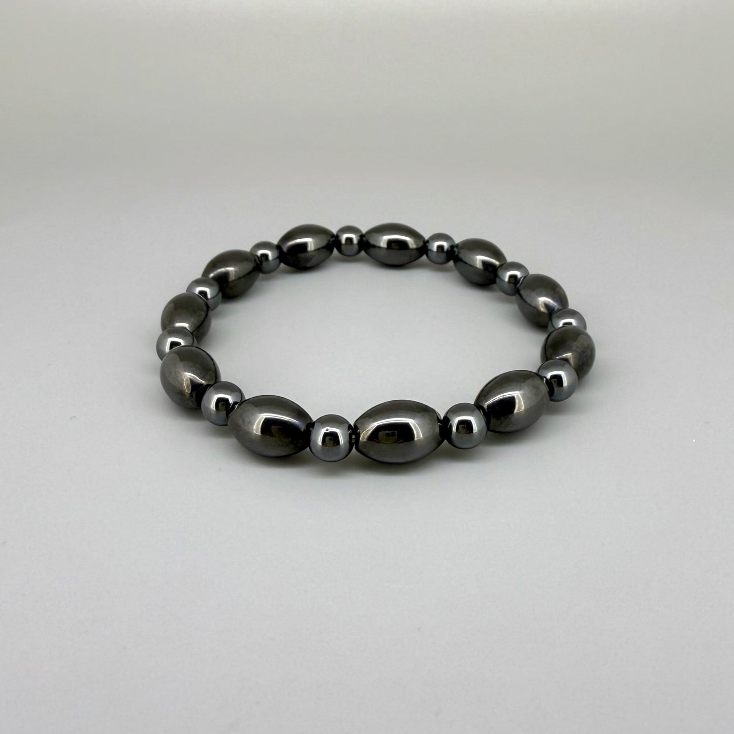 Hematite beaded bracelet, 19cm, dark metallic grey magnetic gemstone beads on elastic stretch band.