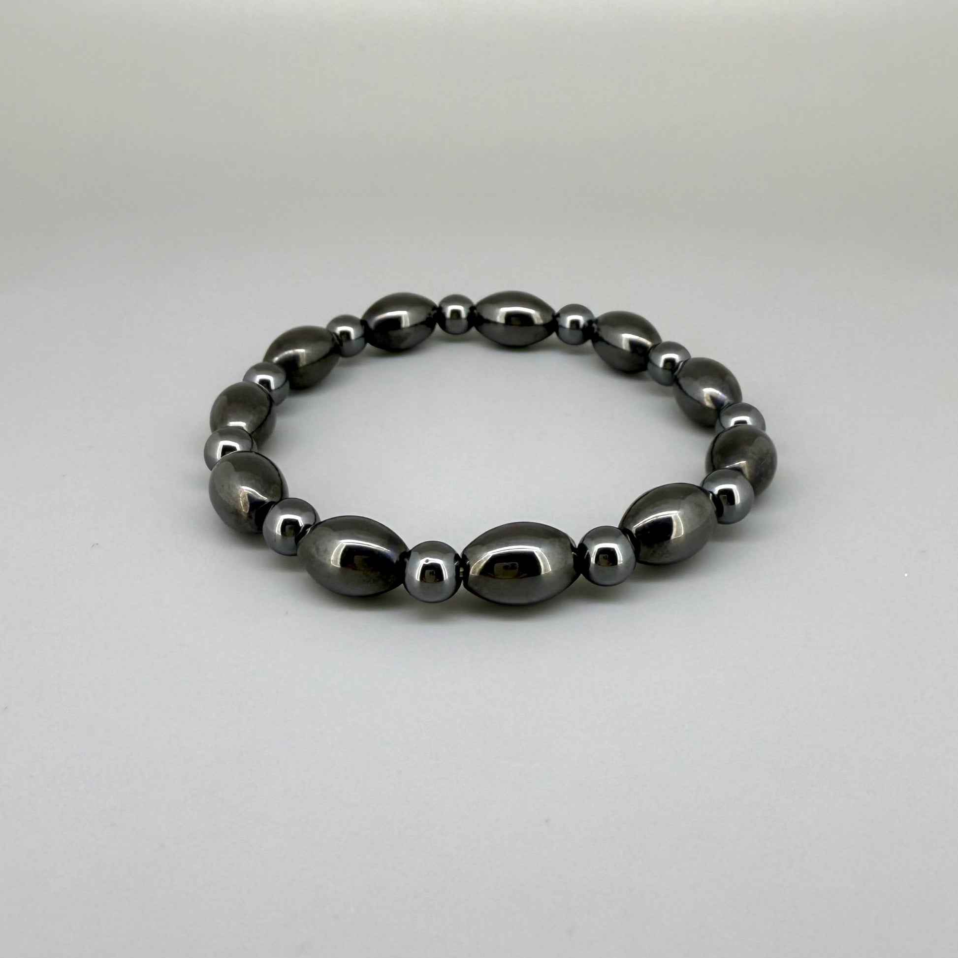 Hematite beaded bracelet, 19cm, dark metallic grey magnetic gemstone beads on elastic stretch band.